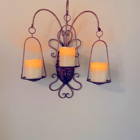 Wall mounted candle sconce. ( Candles not included)